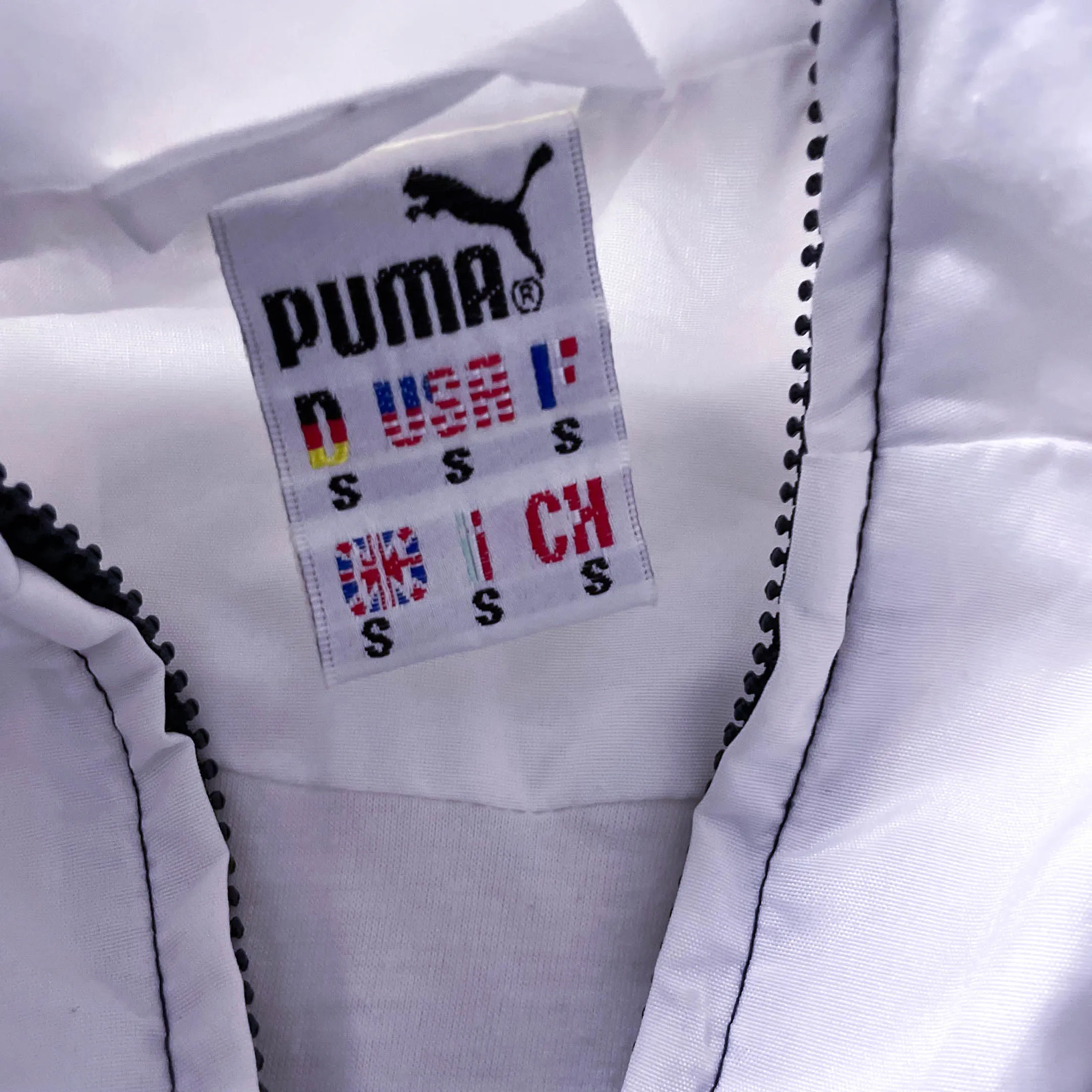 Vintage Men's Puma Castrol black multi stripe full zip jacket in S|L31 W22|SKU 3882